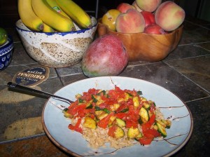 BROWN BASMATI RICE and a quick stir fry of tomatoes, zucchini, yellow crookneck squash, onion, garlic and chunks of chicken breast is a healthy, low calorie meal. Fruit is good for you, too.